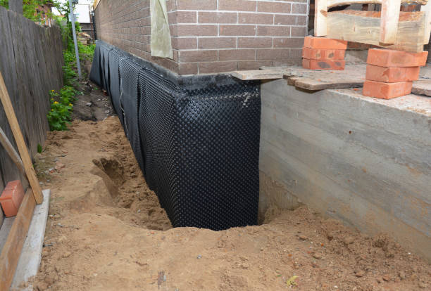 Happy homeowners after waterproofing job in Chilton